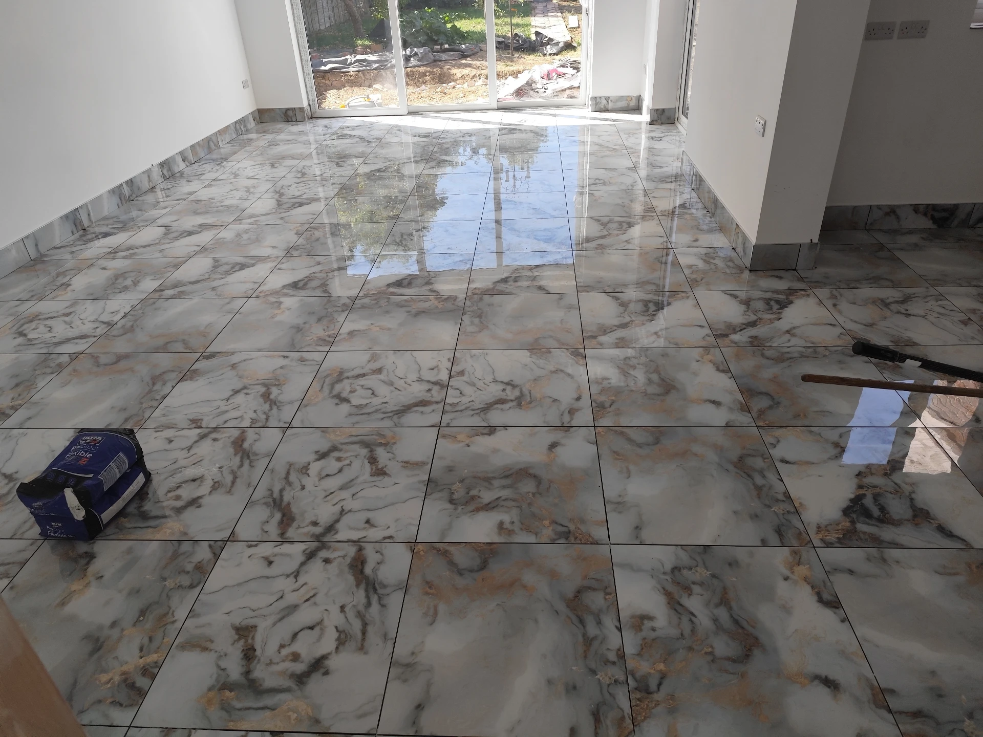 Precision cut stone coping tiles at the edge of a swimming pool